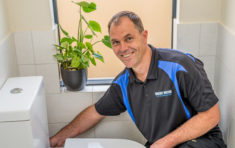 Bright Water For Plumbing & Gas plumber checking toilet