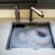 overflowing clogged sink requires professional Bright Water plumber